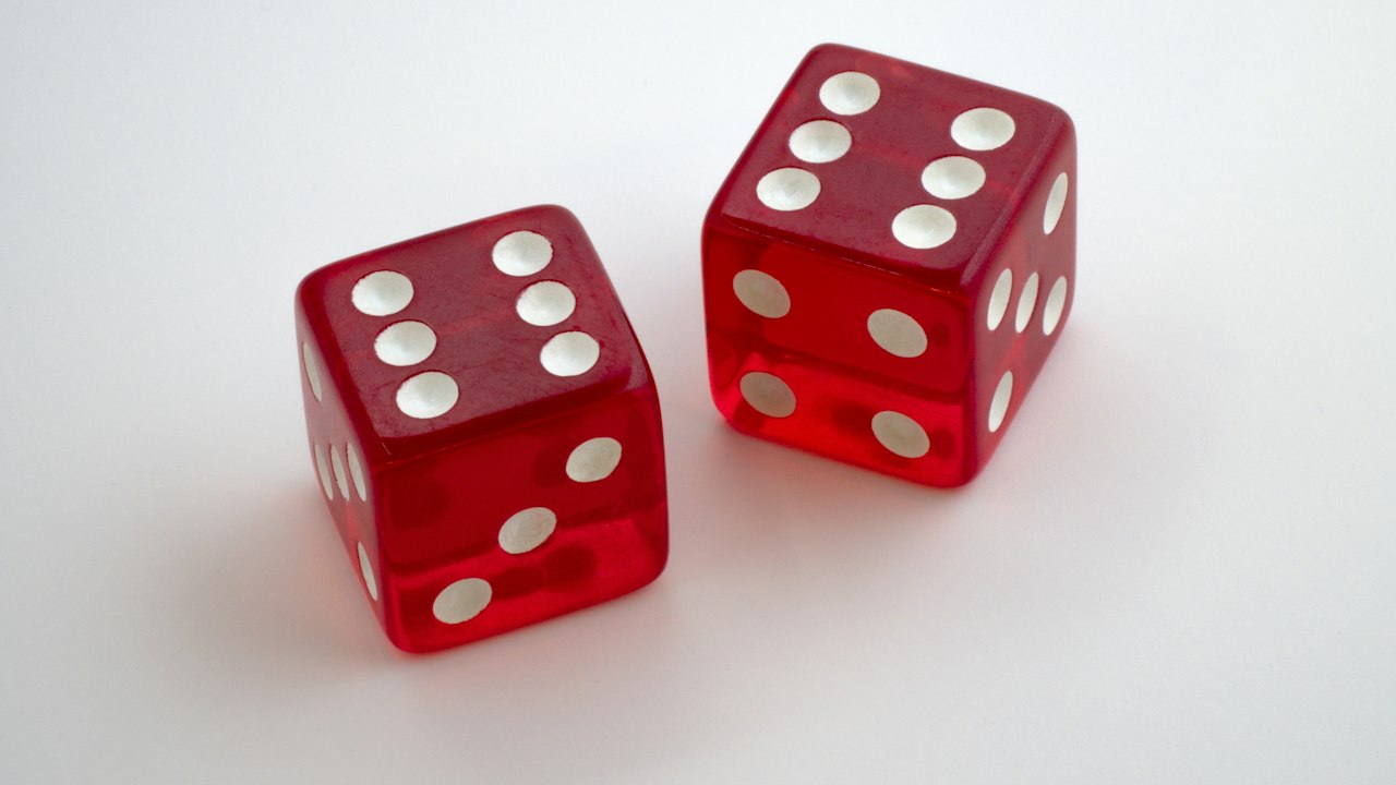 Two red dice showing six